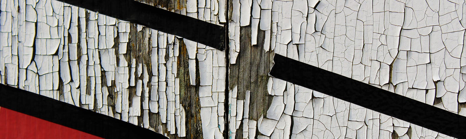 deeply flaked paint on a wooden wall