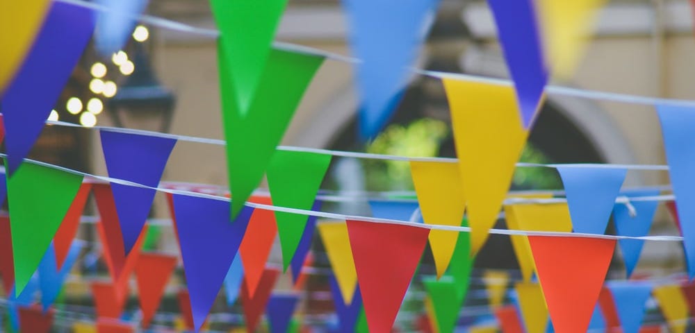 Rows of colorful flags signaling a celebration.