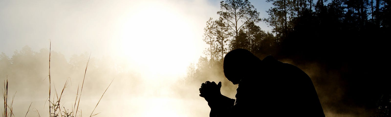 Man praying in nature