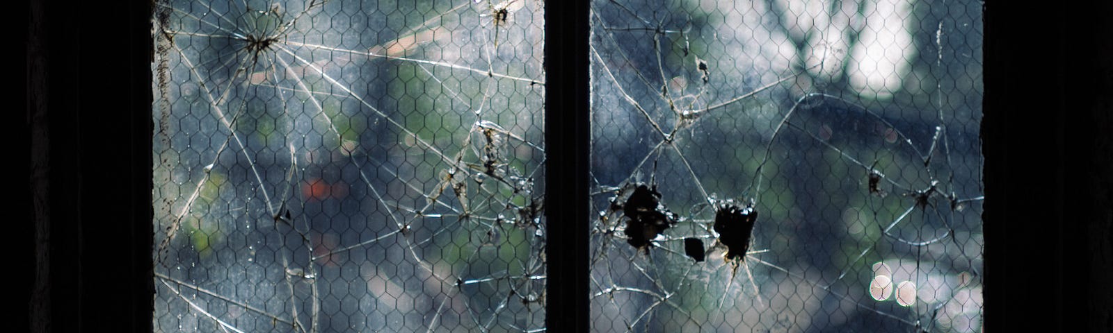 A broken window, illustrating our broken lives.