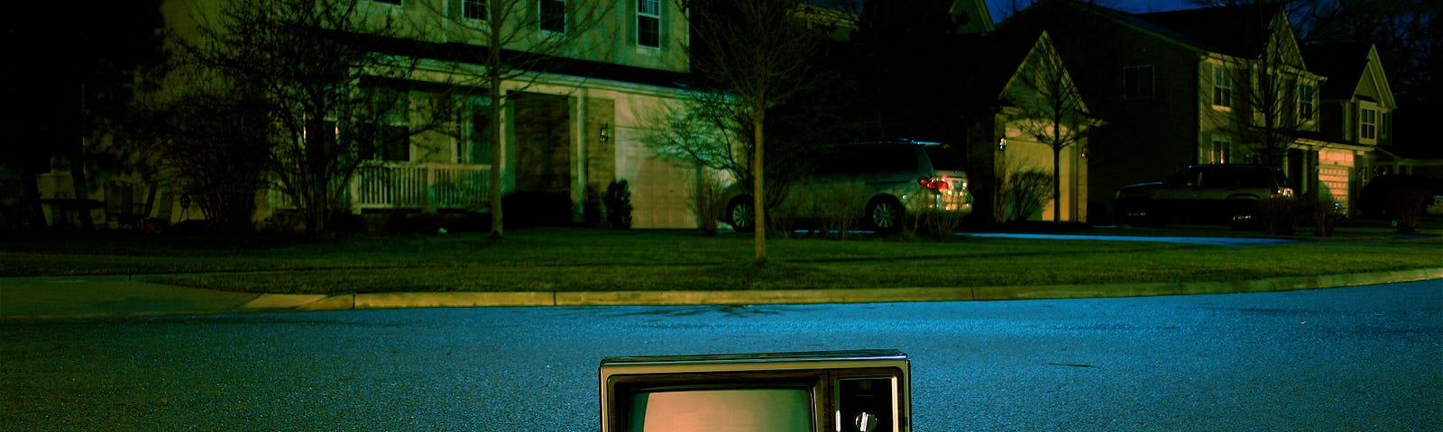 A television in the middle of a street.