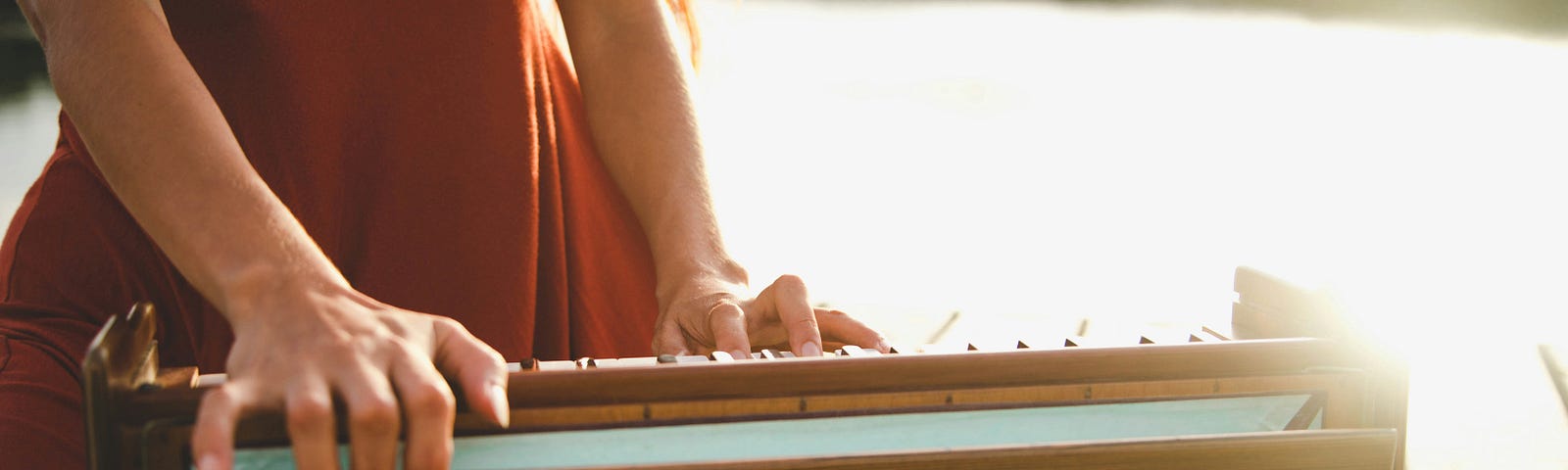 A girl playing the harmonium