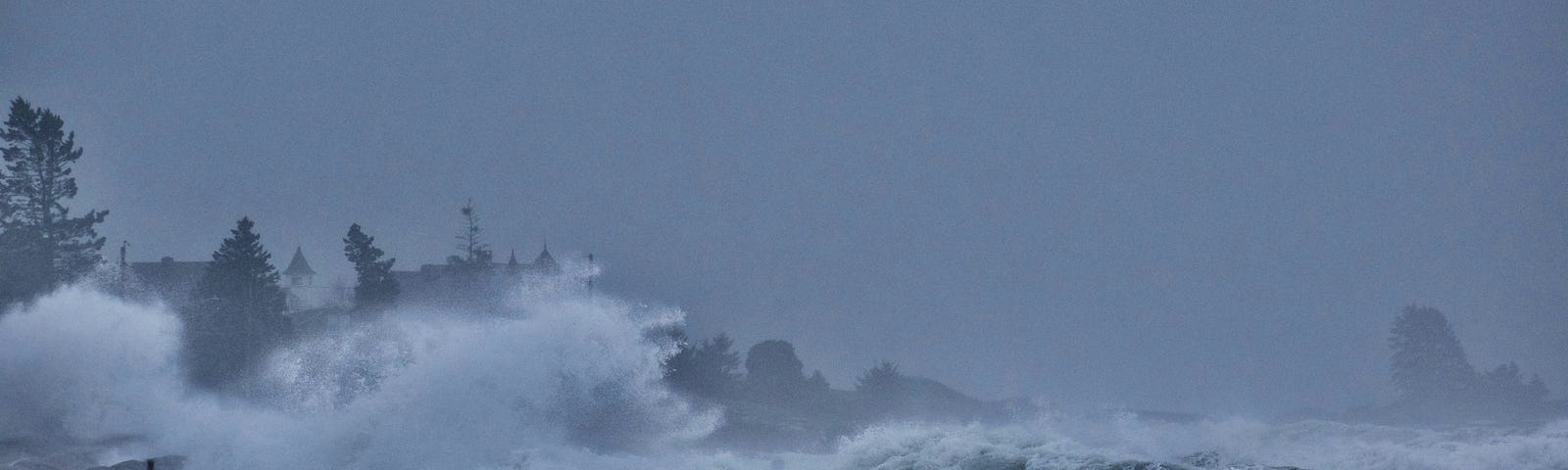 Voilent storm waves break on a seashore.
