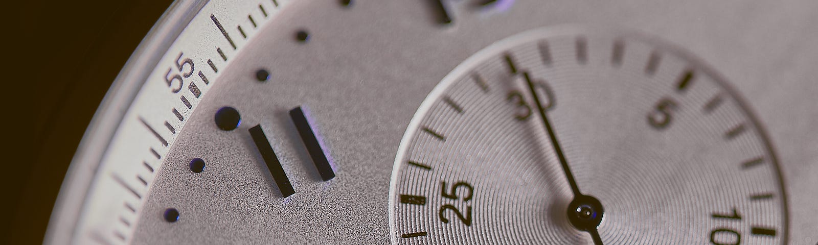 Close up of an analog stopwatch. Blue zone habits can extend lifespan and health span.