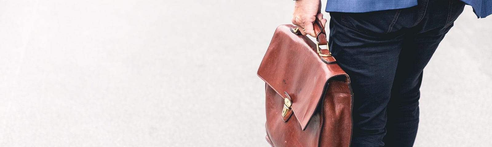 Successful business man carrying a briefcase