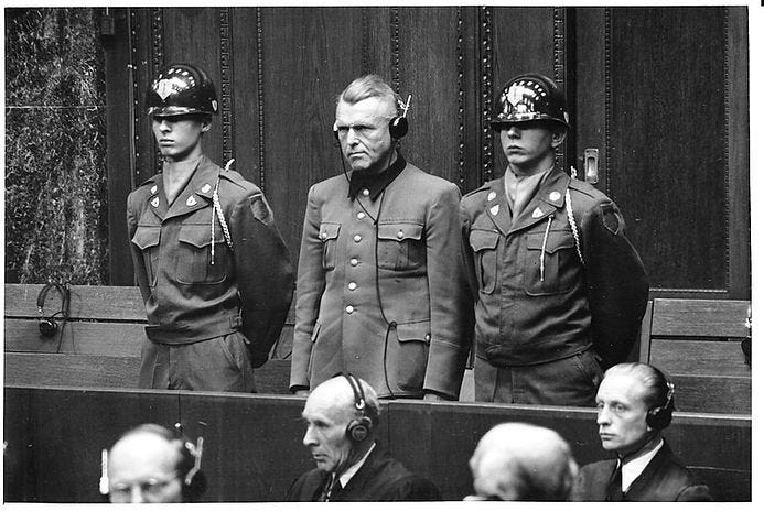 Karl Genzken wearing headphones for translation during sentencing in Doctors’ Trial, 9 December 1946–20 August 1947 (first of the Subsequent Nuremberg Trials) held at the Palace of Justice, Nuremberg. (Source: Wikimedia Commons).