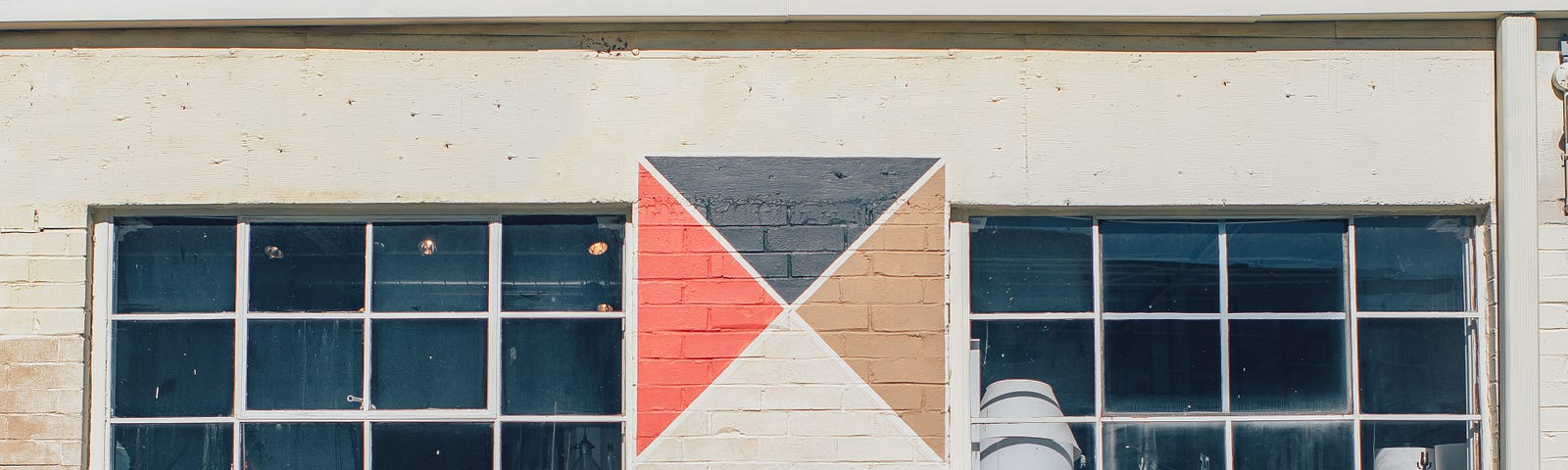 A picture of a brick wall with the words ‘ATLANTA MADE’ written in all capital letters with an arrow pointing to the side