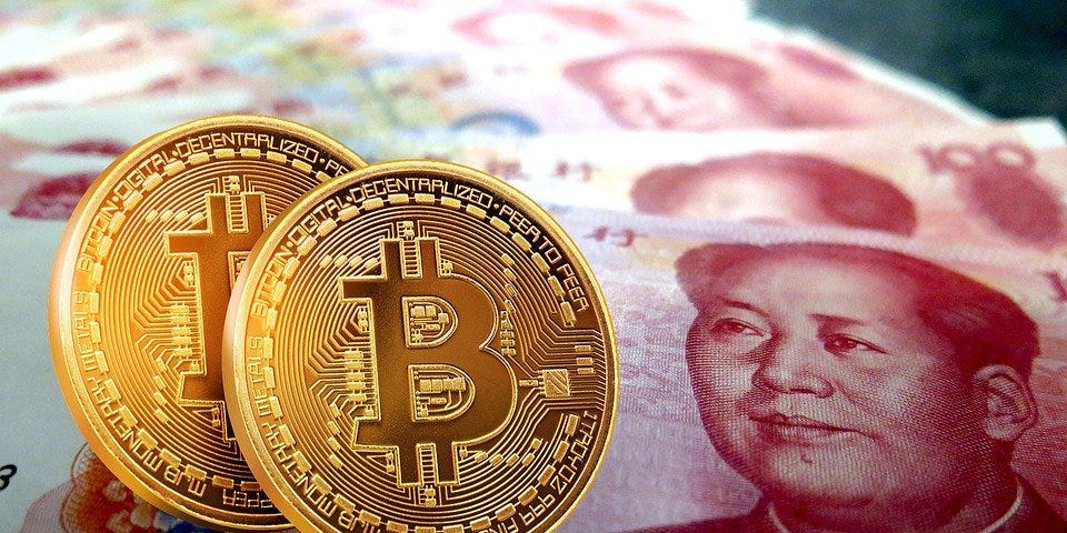 Bitcoin on top of Chinese renminbi/yuan notes