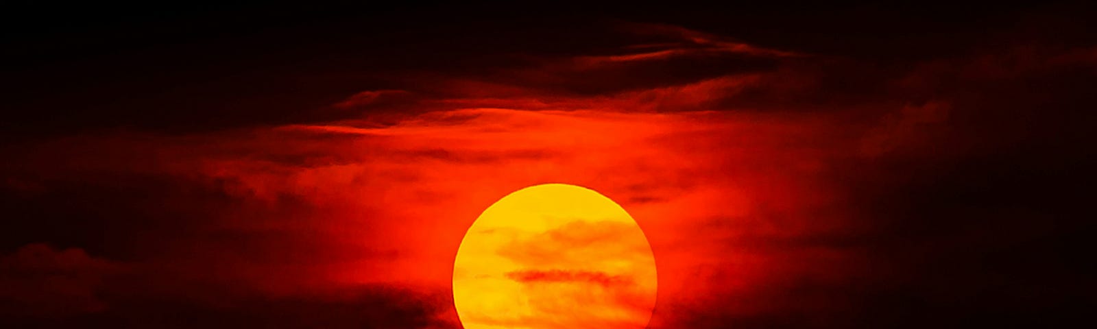 The sun against a crimson sky