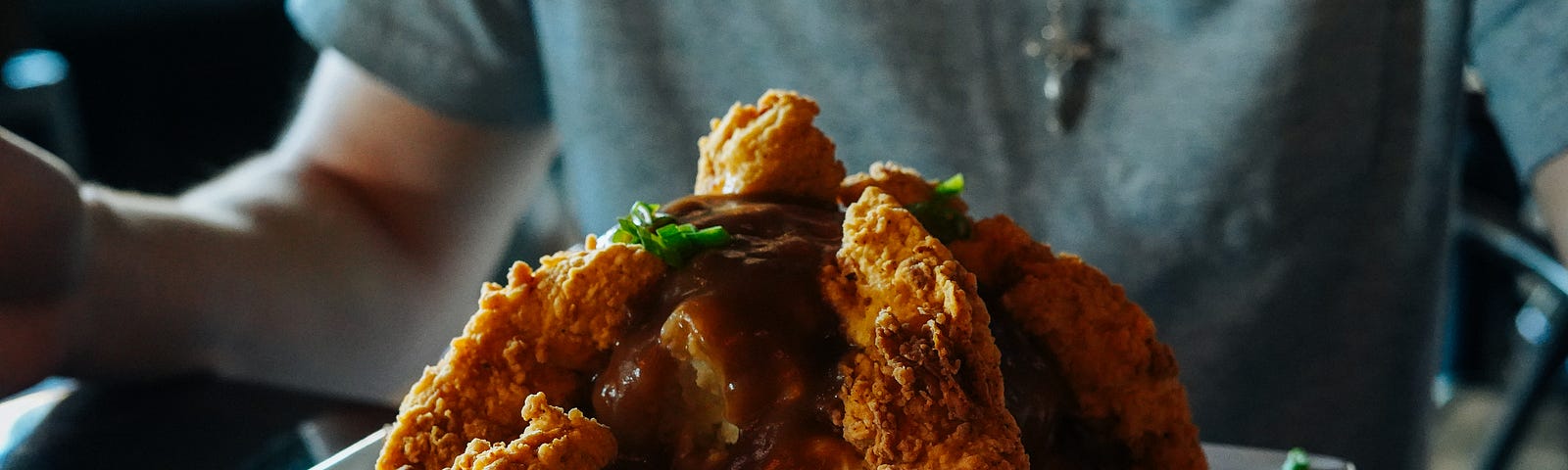 Man enjoying the best fried chicken ever