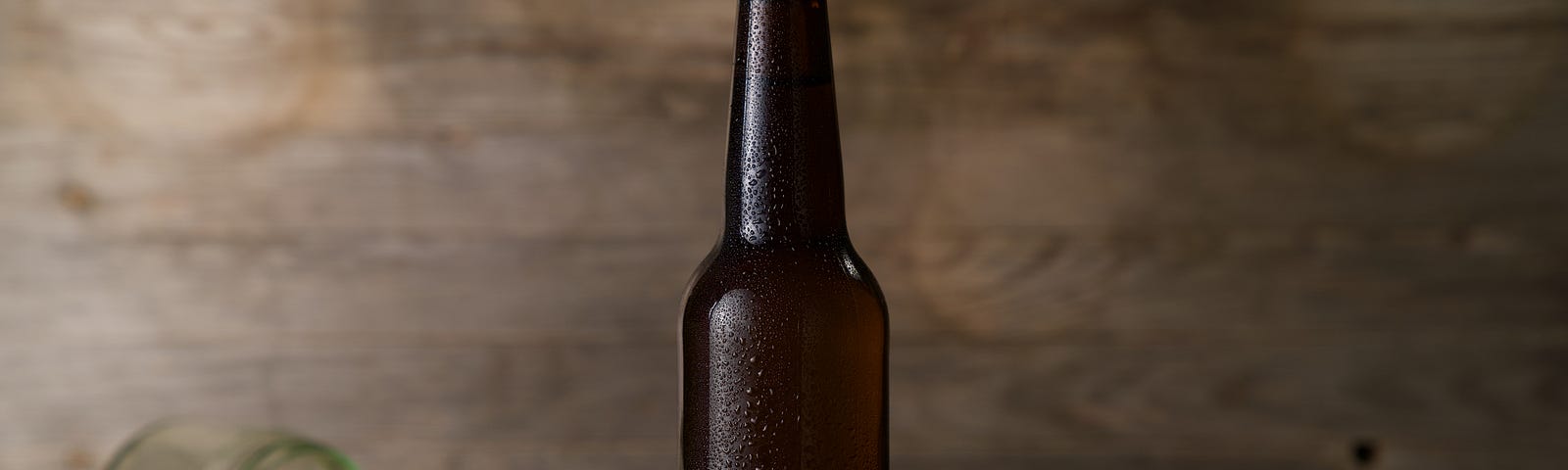 A beer bottle and a fallen jar