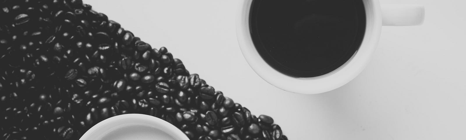 A cup of coffee and a cup of tea on a black and white yin yang background