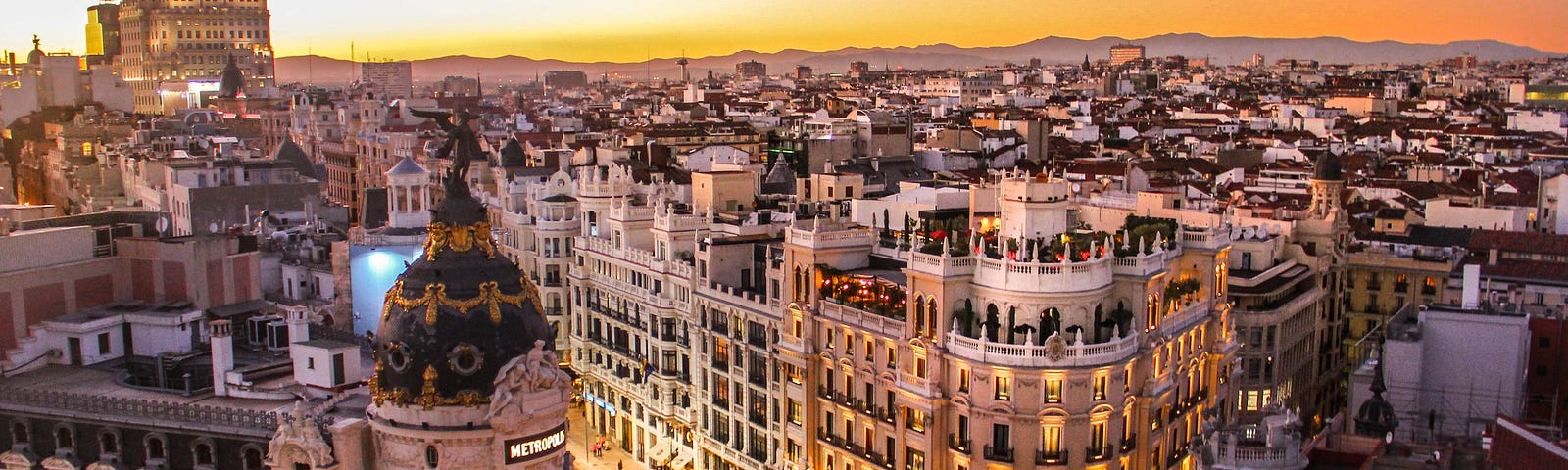 A street corner in Barcelona at sunset.