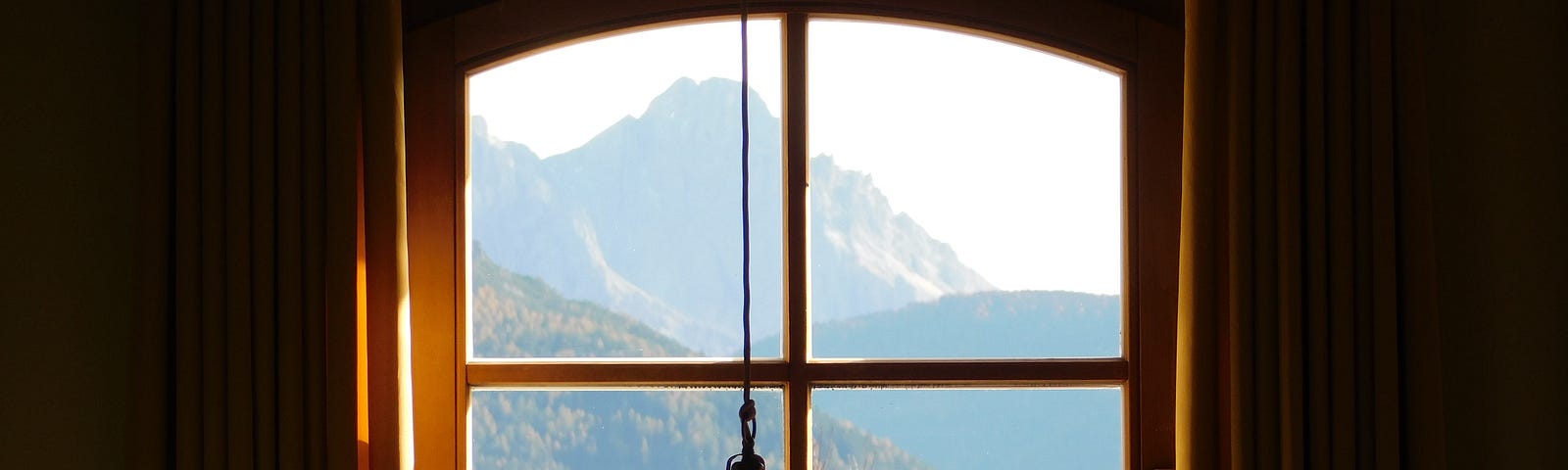 Scene through a window, hills and flowers