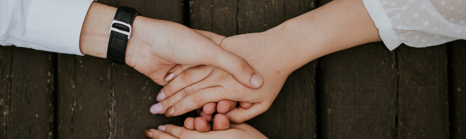 A couple holding hands.