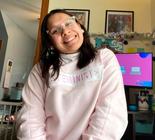 A picture of me in a pink STEMINIST sweater