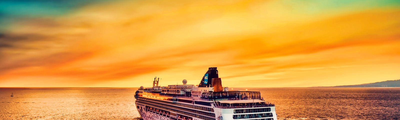 shows a cruise ship on the ocean heading toward a colorful sunset