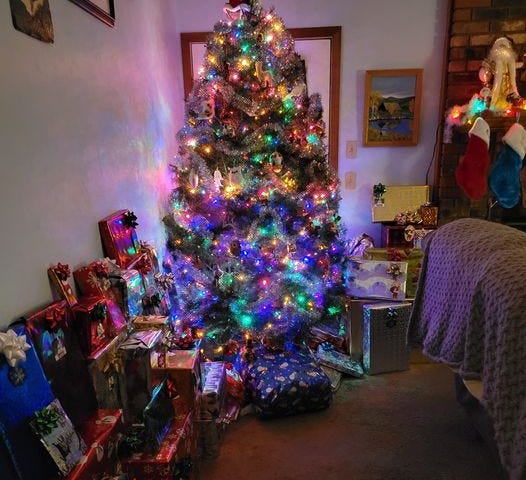 lighted Christmas Tree with presents.