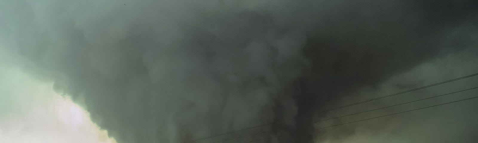 a large tornado heading across farmland