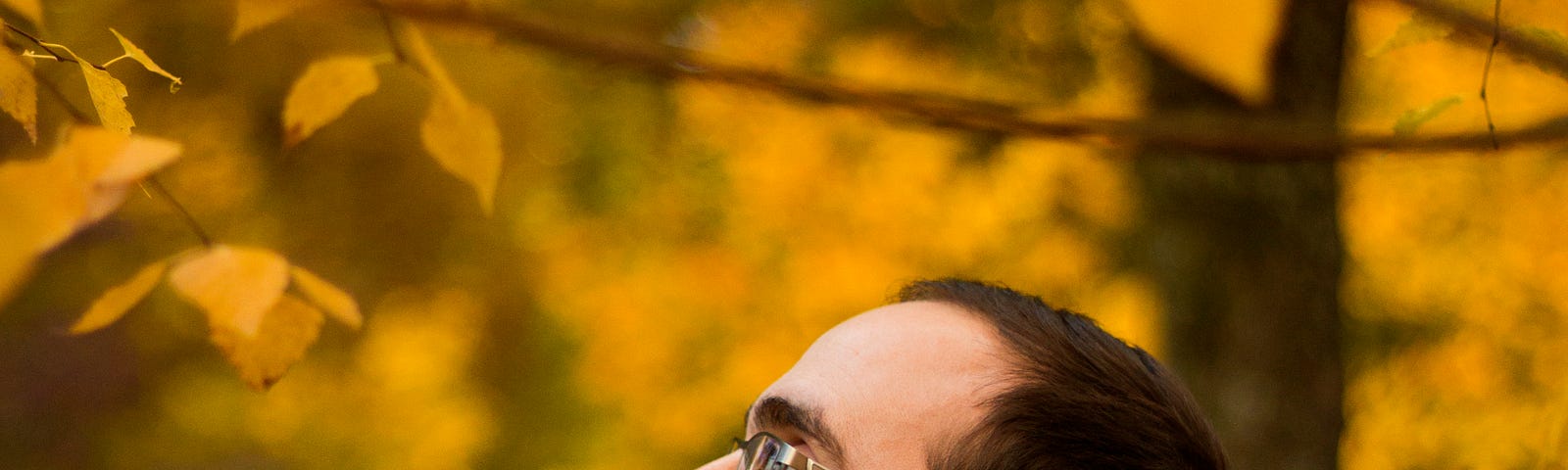 Bearded man enjoying the fall colors