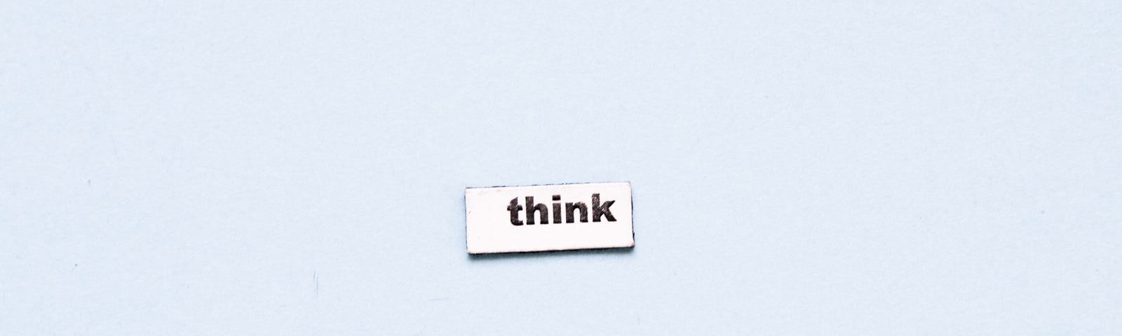 “think” on a small piece of paper
