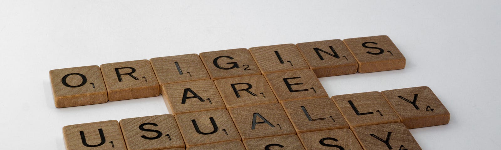 Scrabble letters arranged into, “Origins are usually messy”.