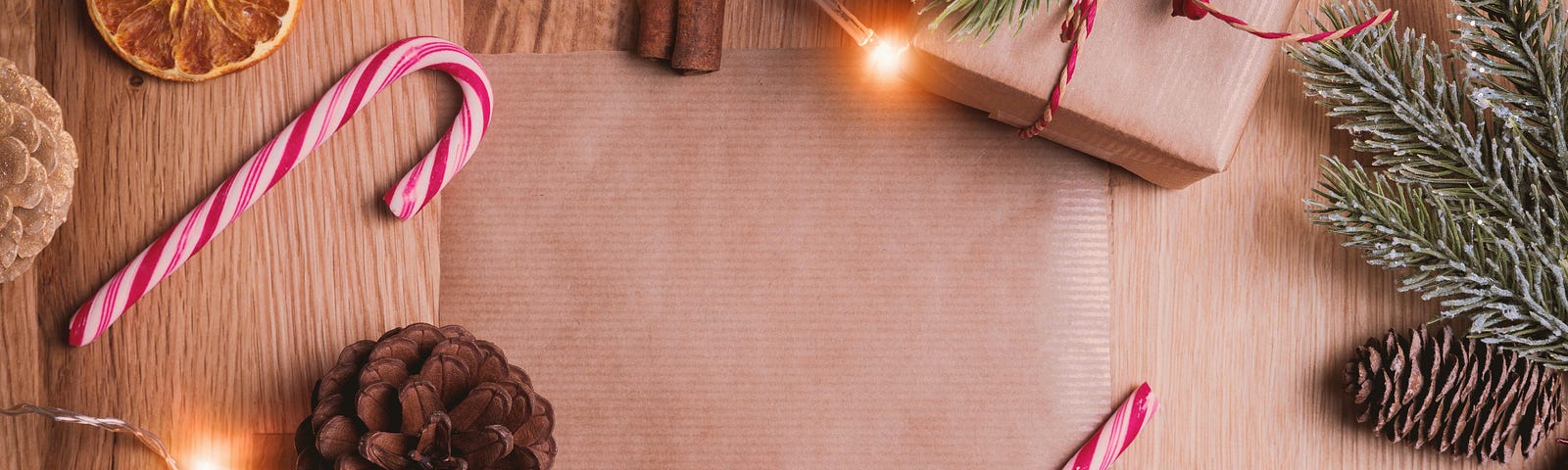 A photo of Christmas ornaments spread on a wooden table