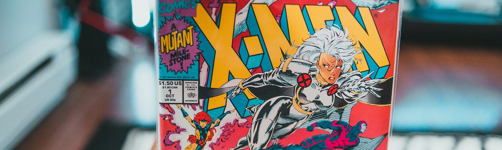 Someone pulling X-Men #1 out of a crate full of comics