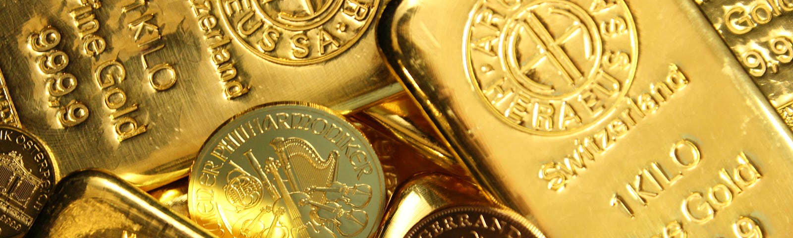 A collection of vintage gold coins and gold bullion.