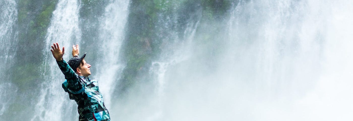 The writer pictures a young person near a waterfall.