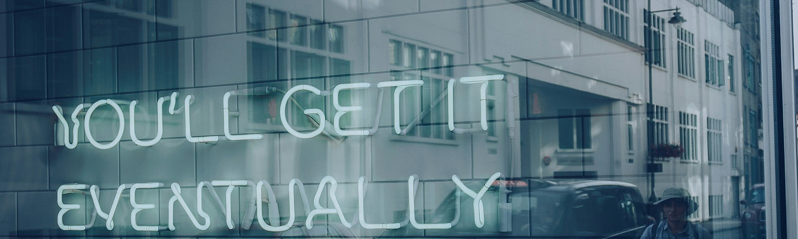 Neon sign that says ‘You’ll get it eventually’.