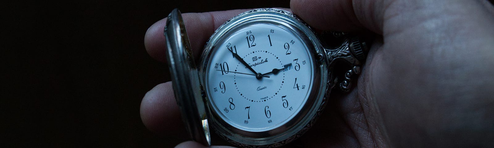 Is this hand holding a pocket watch counting down the last minutes America’s democracy has left?