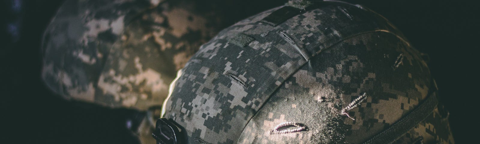 A pair of standard military issue helmets