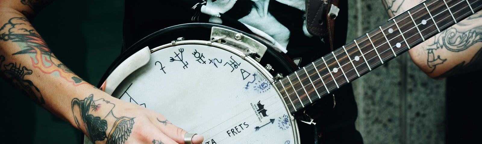 Tattooed banjo player