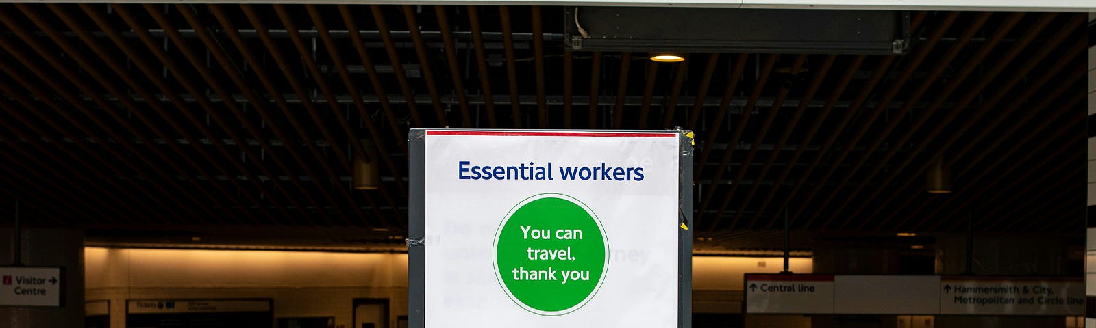 A sign in the London Tube alludes to the fact that those with COVID whould not travel.