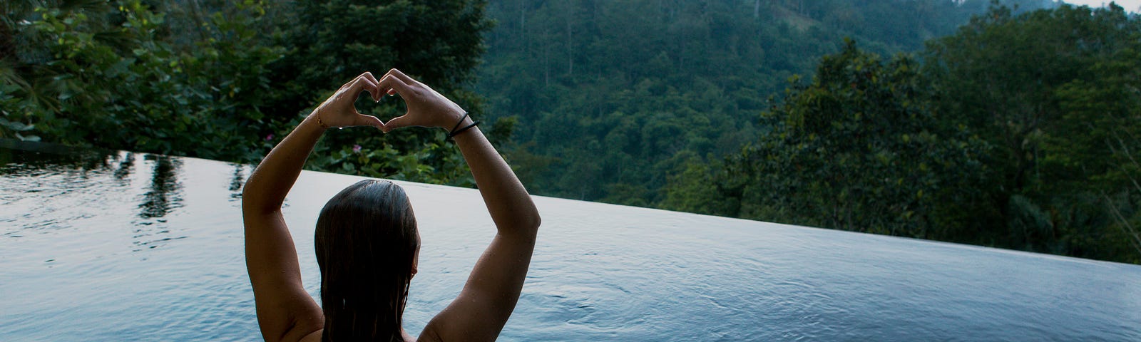 Woman overlooking lush tropical climate