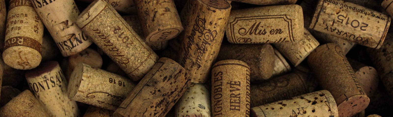 There’s a collection of wine corks in a pile.