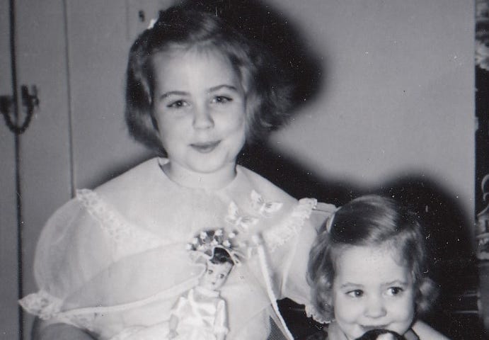2 young sisters era 1960 dressed up