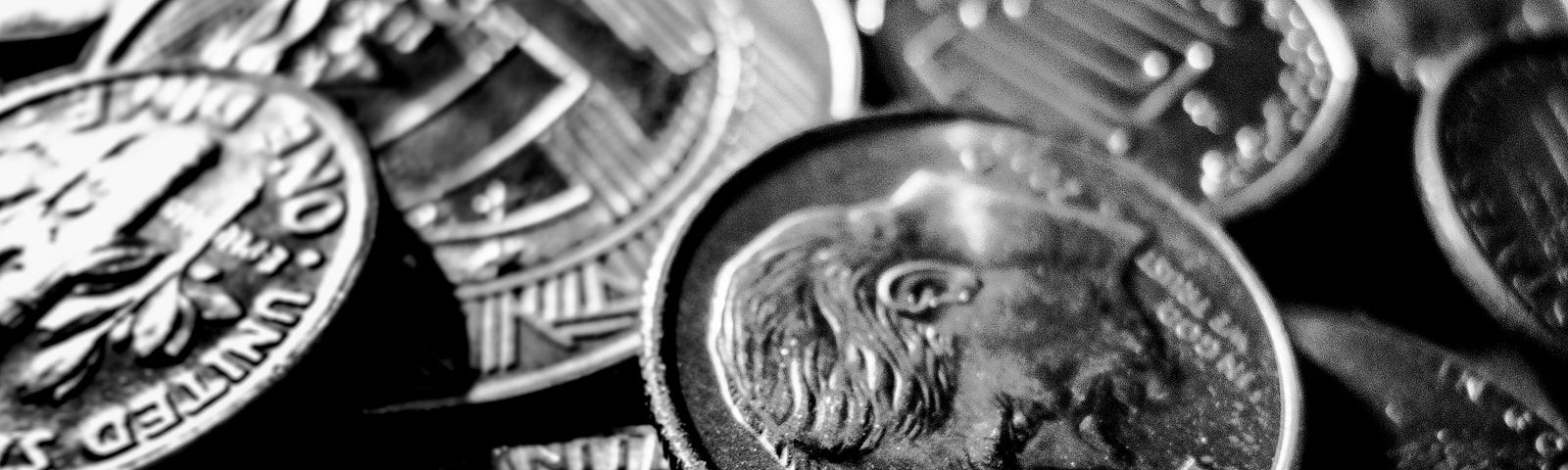 Coins with a dime faceup in the foreground.