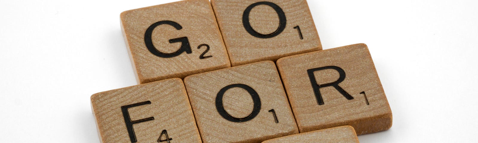 Scrabble letters saying Go For It