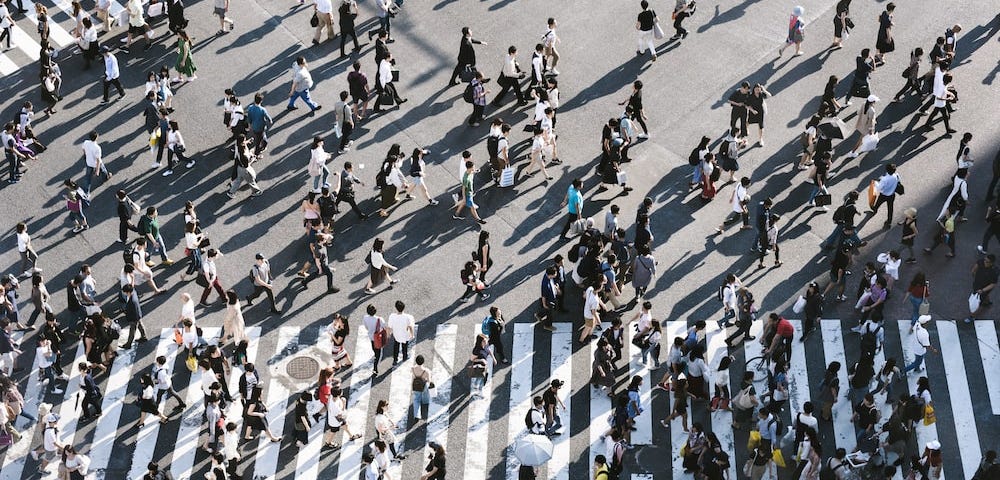 A crowd of people crossing the street in Shibuya