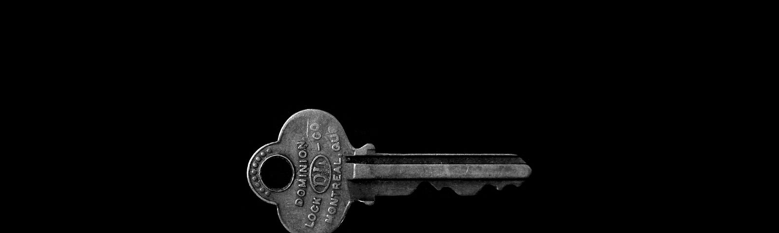 A black background with a key in the middle