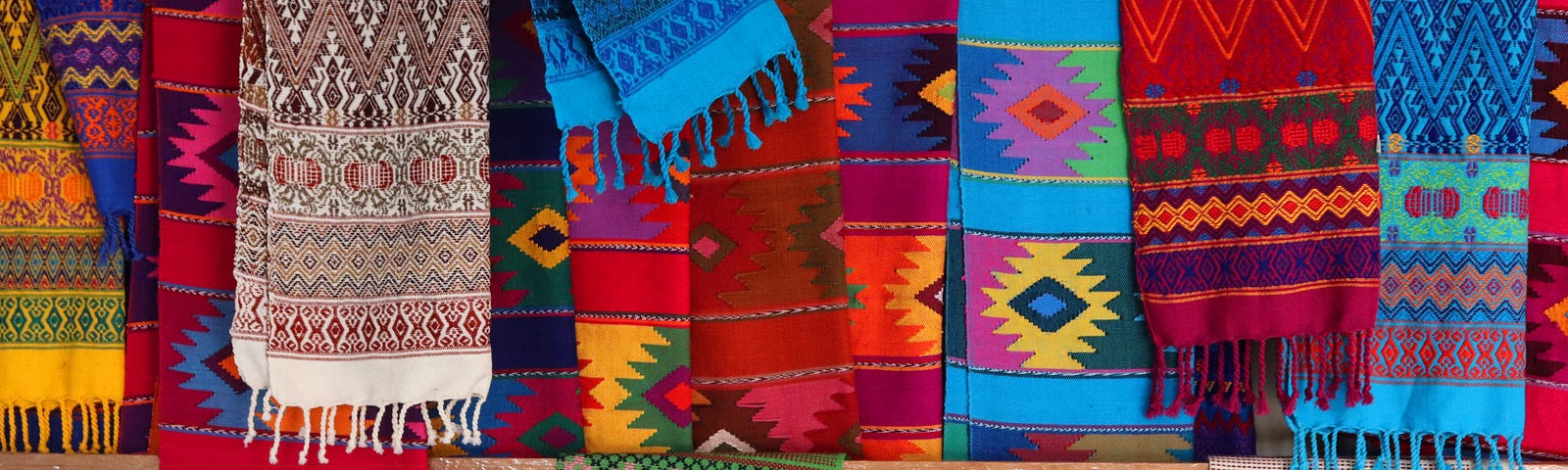 a display of multicolored mexican scarves