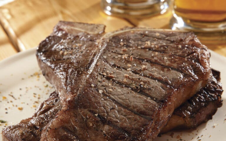 Seasoned T-Bone Steak on a Plate