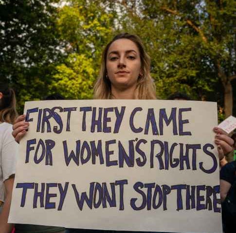 Woman holding a women’s rights placard