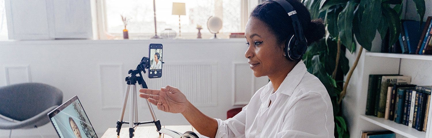 Woman teaching another person virtually