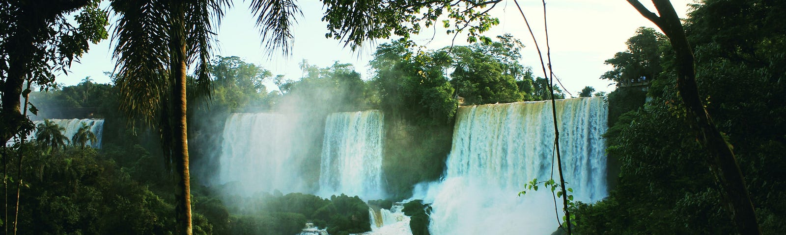 A series of waterfalls in a jungle.
