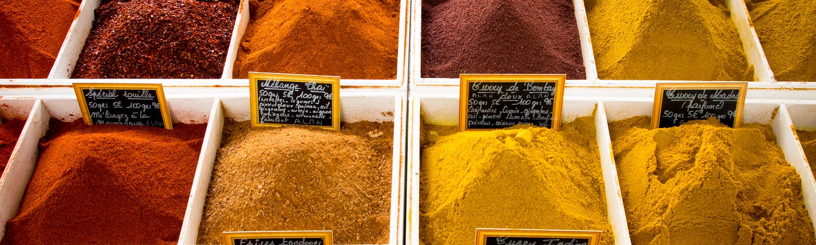 Many different colored spices for sale