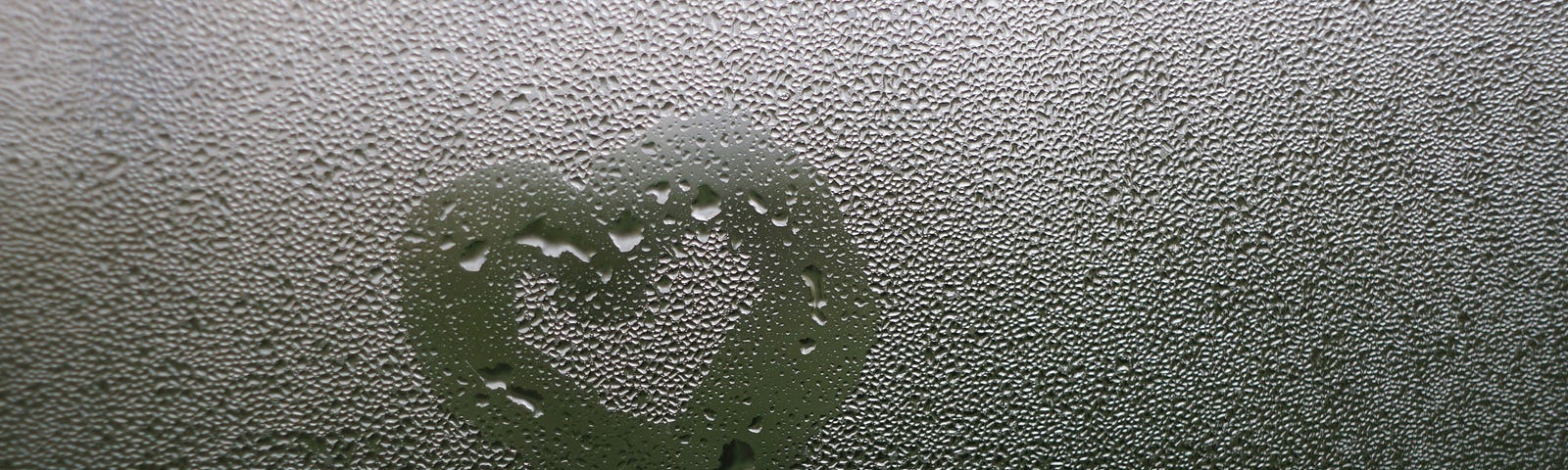 Heart drawn in condensation on a window