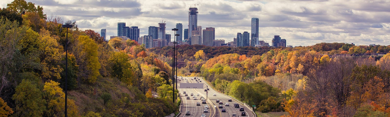 A highway with a city in the distance